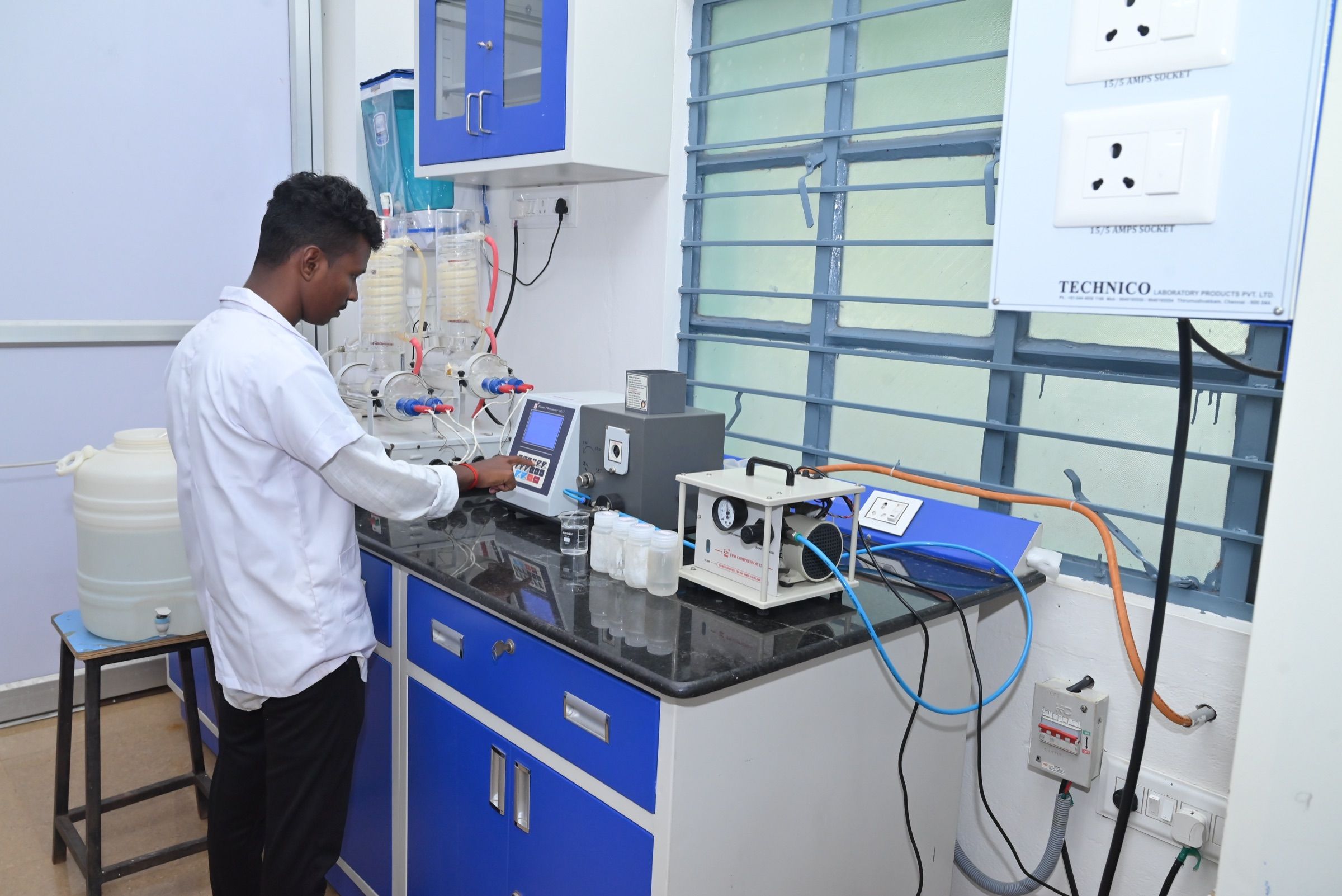 Analyst running a sample on the instrument bench