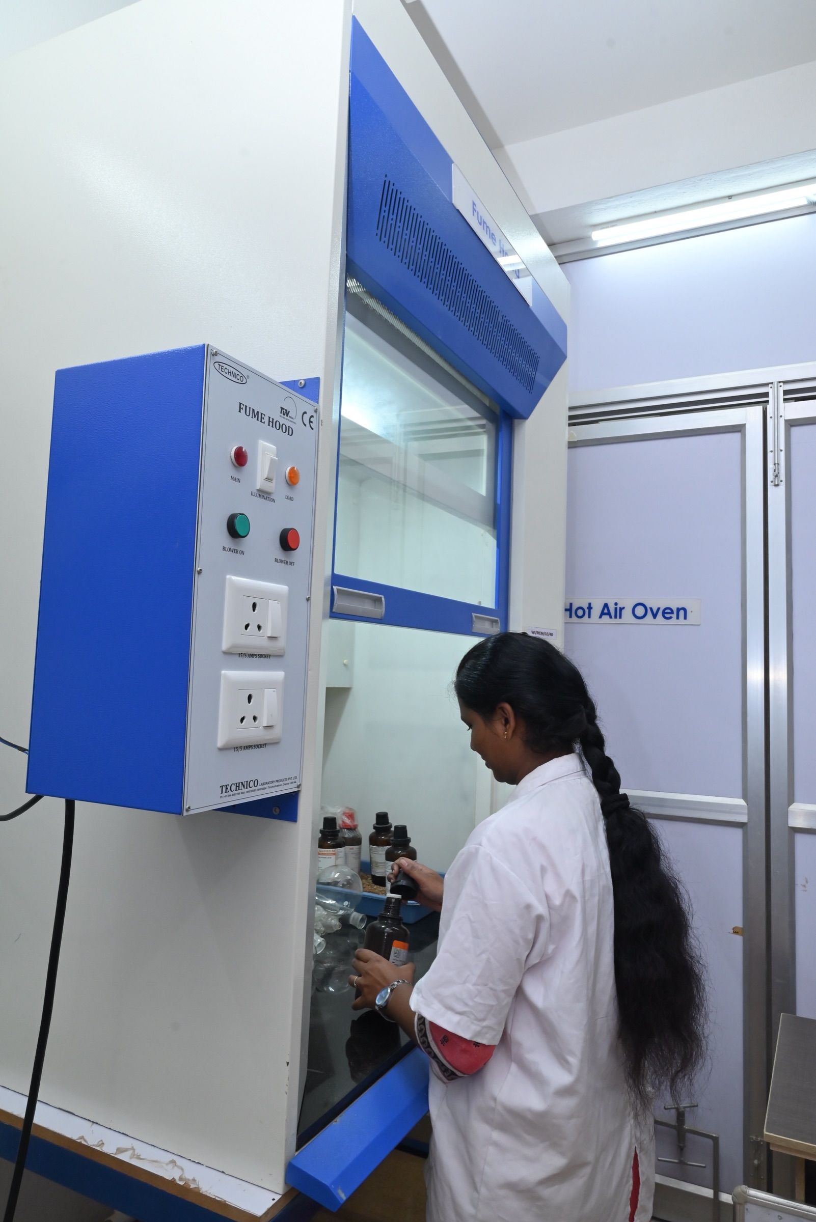 Analyst working inside the chemical fume hood