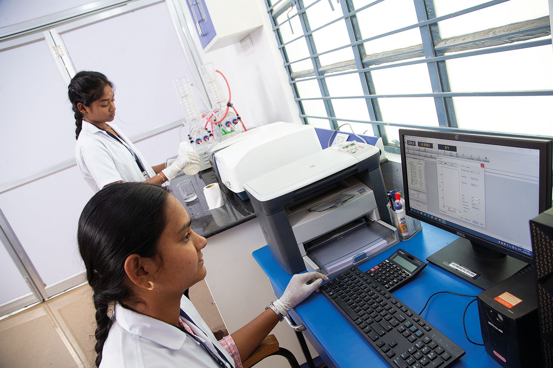 Analysts recording results at the reporting workstation